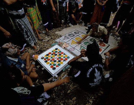 People Playing Game During Cremation. Bongkasa, Indonesia
