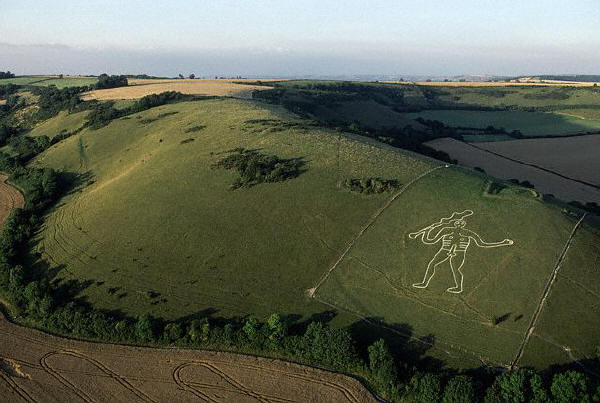 The 180 ft high chalk fertility figure of the Cerne Abbas Giant, carved onto a hillside, England