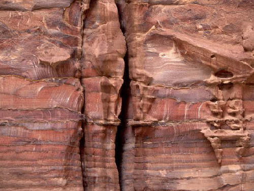 Crevices in a sandstone rockface at Petra