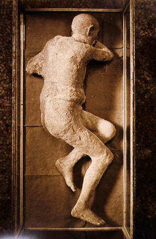 The mummified corpse of a man stands in the museum in Pompeii, Italy